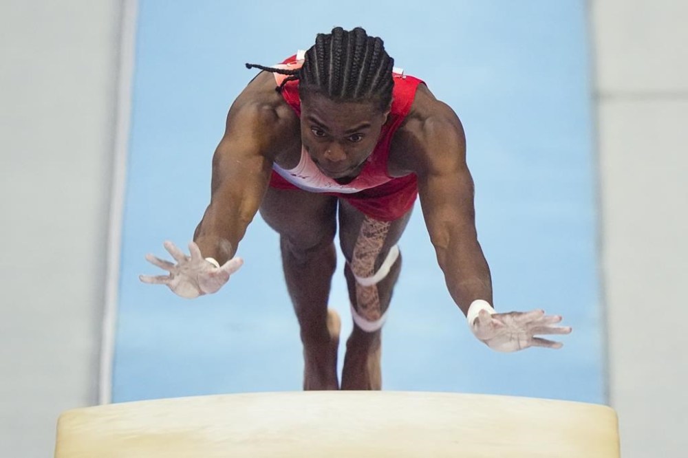 Khoi Young competes on the vault at the United States Gymnastics Olympic Trials on Thursday, June 27, 2024 in Minneapolis. (AP Photo/Charlie Riedel)