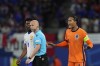 Virgil van Dijk of the Netherlands, right, protest to the referee Anthony Taylor of England, after a goal scored by a teammate was disallowed during a Group D match between the Netherlands and France at the Euro 2024 soccer tournament in Leipzig, Germany, Friday, June 21, 2024. (AP Photo/Mathias Schrader)