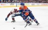 Colorado Avalanche's Nathan MacKinnon (29) and Edmonton Oilers' Connor McDavid (97) battle for the puck during overtime NHL action in Edmonton, Saturday, March 16, 2024. THE CANADIAN PRESS/Jason Franson