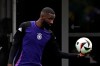 Germany's Antonio Rüdiger holds a ball during the last training session before their round of 16 match, in Herzogenaurach, Germany, Friday June 28, 2024. Germany will face Denmark on the round of 16 of the Euro 2024, next Saturday June 29. (Federico Gambarini/dpa via AP)