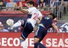 Vancouver Whitecaps forward Brian White (24) defends the ball from New England Revolution defender Xavier Arreaga (3) during the first half of an MLS soccer match Saturday, June 15, 2024, in Foxborough, Mass. THE CANADIAN PRESS/AP-Mark Stockwell