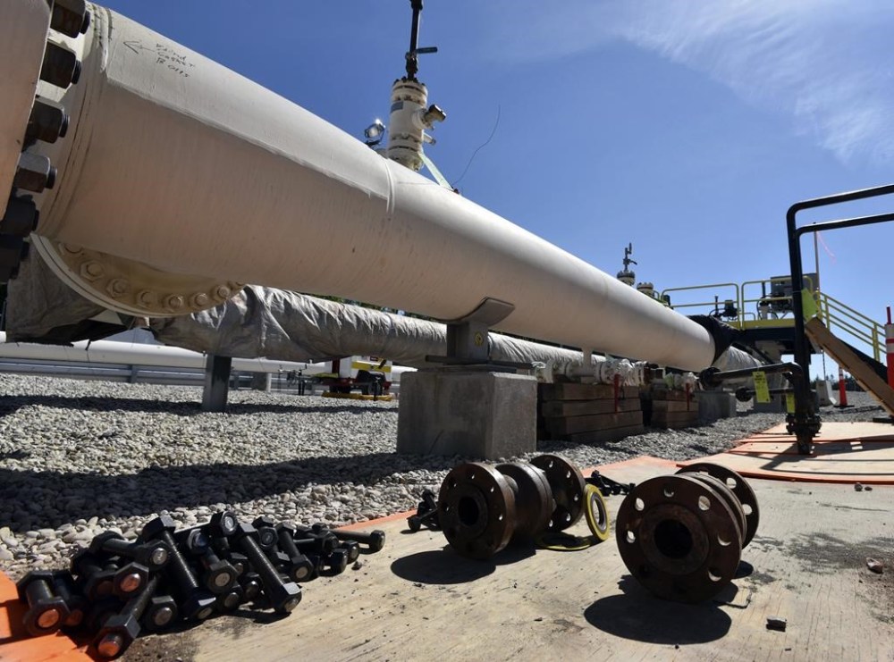 FILE - In this June 8, 2017, file photo, fresh nuts, bolts and fittings are ready to be added to the east leg of the pipeline near St. Ignace, Mich., as Enbridge prepares to test the east and west sides of the Line 5 pipeline under the Straits of Mackinac in Mackinaw City, Mich. Environmentalists are challenging Michigan regulators' decision to approve encasing part of an aging Enbridge Energy oil pipeline that runs beneath a channel connecting two Great Lakes, arguing that they failed to properly consider alternatives that would minimize climate impacts. (Dale G Young/Detroit News via AP, File)