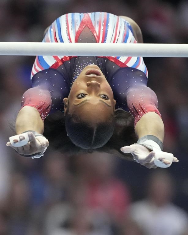 Shilese Jones competes on the uneven bars at the United States Gymnastics Olympic Trials on Friday, June 28, 2024 in Minneapolis. (AP Photo/Charlie Riedel)