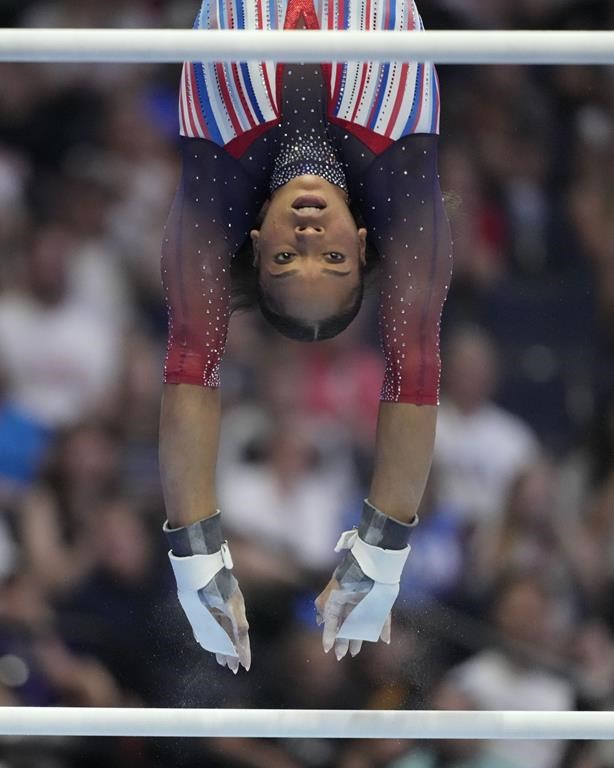 Shilese Jones competes on the uneven bars at the United States Gymnastics Olympic Trials on Friday, June 28, 2024 in Minneapolis. (AP Photo/Charlie Riedel)