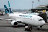 WestJet airplane mechanics are hitting the picket lines in a surprise move that threatens to disrupt flights for thousands of travellers at the outset of the Canada Day long weekend. WestJet passenger jets parked at departure gates at the Calgary International Airport, Wednesday, May 31, 2023. THE CANADIAN PRESS/Jeff McIntosh