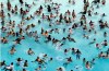 FILE - Swimmers try to stay cool in near 100 degree temperatures at Red Oaks Waterpark in Madison Heights, Mich., June 28, 2012. The Centers for Disease Control and Prevention says drowning is the leading cause of death for children ages 1 to 4. It's also the second leading cause of unintentional death for those ages 5 to 14. (AP Photo/Paul Sancya, File)
