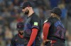 Toronto Blue Jays Tim Mayza stands on the mound with first base Vladimir Guerrero Jr. and third base Isiah Kiner-Falefa, as he waits to be pulled from the game during the ninth inning of the Jays' 16-5 loss to New York Yankees in American League MLB baseball action in Toronto, Friday, June 28, 2024. THE CANADIAN PRESS/Chris Young