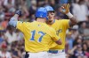 Boston Red Sox's Jarren Duran celebrates his solo home run with Tyler O'Neill (17) during the sixth inning of a baseball game against the San Diego Padres, Saturday, June 29, 2024, in Boston. (AP Photo/Michael Dwyer)