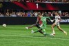 Atlanta United forward Jamal Thiaré, left, kicks the winning goal past Toronto FC goalkeeper Luka Gavran (90) and midfielder Kosi Thompson, right, during the second half of an MLS soccer match, Saturday, June 29, 2024, in Atlanta. (AP Photo/Danny Karnik)