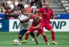 Vancouver Whitecaps' Levonte Johnson (28), left, St. Louis City's John Klein (41), middle, and St. Louis City's Tomas Totland, right, vie for the ball during the first half of an MLS soccer match in Vancouver, B.C., Saturday, June 29, 2024. THE CANADIAN PRESS/Ethan Cairns