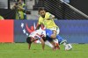 Brazil's Douglas Luiz and Paraguay's Adrian Cubas battle for the ball during a Copa America Group D soccer match in Las Vegas, Friday, June 28, 2024. (AP Photo/David Becker)