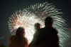 People watch as fireworks explode over LeBreton Flats area during Canada Day celebrations in downtown Ottawa, on Saturday, July 1, 2023. THE CANADIAN PRESS/Spencer Colby