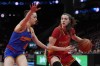 East forward Syla Swords (8) defends West guard Morgan Cheli (21) during the first quarter of the McDonald's All American girl's basketball game Tuesday, April 2, 2024, in Houston. THE CANADIAN PRESS/AP-Kevin M. Cox