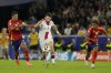 Georgia's Khvicha Kvaratskhelia fights for the ball against Spain's Rodri during a round of sixteen match between Spain and Georgia at the Euro 2024 soccer tournament in Cologne, Germany, Sunday, June 30, 2024. (AP Photo/Darko Vojinovic)