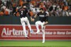 Baltimore Orioles shortstop Gunnar Henderson (2) and right fielder Anthony Santander, right, celebrate after they defeated the Texas Rangers in a baseball game, Saturday, June 29, 2024, in Baltimore. (AP Photo/Terrance Williams)