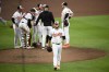Baltimore Orioles starting pitcher Cole Irvin (19) walks back to the dugout after he was removed during the fourth inning of a baseball game against the Texas Rangers, Sunday, June 30, 2024, in Baltimore. (AP Photo/Nick Wass)