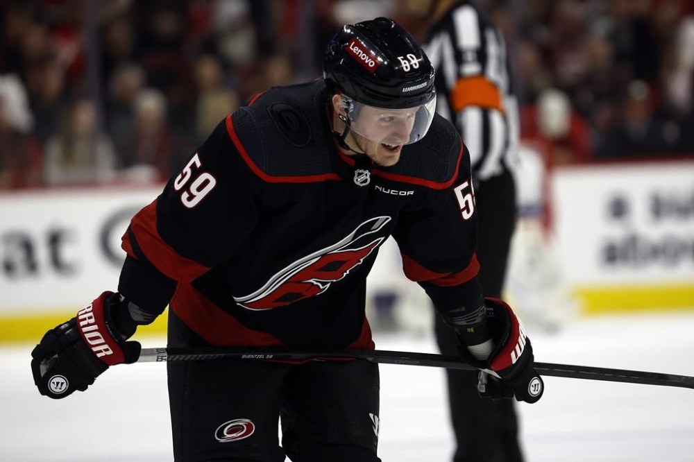 Carolina Hurricanes' Jake Guentzel (59) skates against the New York Islanders during the third period in Game 2 of an NHL hockey Stanley Cup first-round playoff series in Raleigh, N.C., Monday, April 22, 2024. The Atlantic Division got down to business ahead of NHL free agency's opening bell.The Tampa Bay Lightning signed prized winger Jake Guentzel to a seven-year, US$63-million deal Monday — roughly three hours before players on expiring contracts went to market at 12 p.m. ET. THE CANADIAN PRESS/AP/Karl B DeBlaker