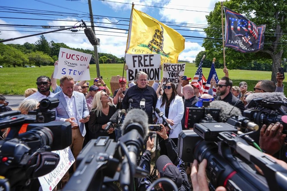 Steve Bannon, center, speaks outside Danbury Federal Correctional Institution, Monday, July 1, 2024, in Danbury, Conn. (AP Photo/Julia Nikhinson)