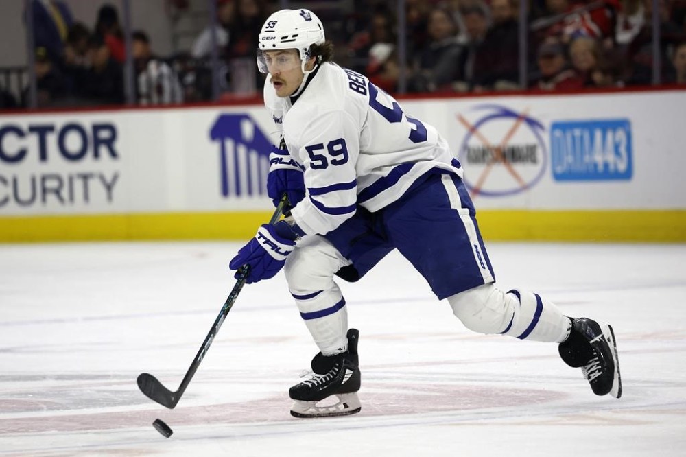 FILE - Toronto Maple Leafs' Tyler Bertuzzi (59) skates with the puck against the Carolina Hurricanes during the third period of an NHL hockey game in Raleigh, N.C., Sunday, March 24, 2024. Bertuzzi joined Connor Bedard in Chicago on the first day of NHL free agency, agreeing to a $22 million, four-year contract with the rebuilding Blackhawks on Monday, July 1, 2024. (AP Photo/Karl B DeBlaker, FIle)