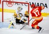 Calgary Flames forward Yegor Sharangovich scores past Pittsburgh Penguins goalie Tristan Jarry during NHL action in Calgary, Saturday, March 2, 2024. The Flames have re-signed forward Yegor Sharangovich to a five-year, US$28.75-million contract.THE CANADIAN PRESS/Jeff McIntosh