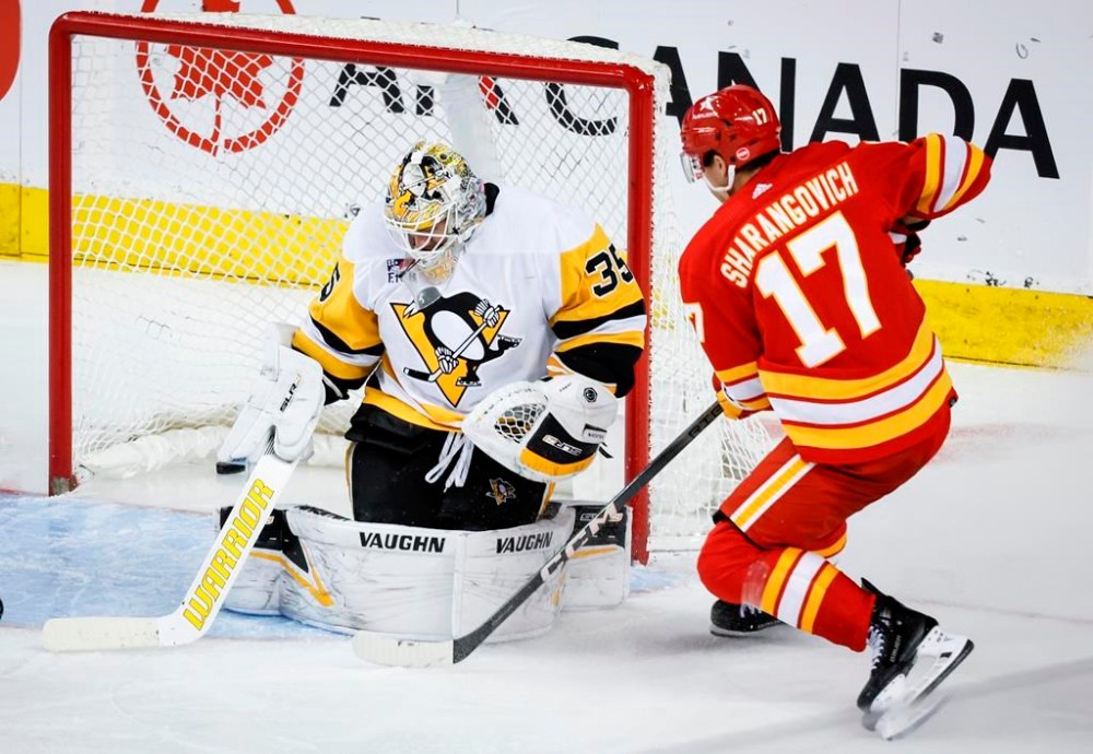Calgary Flames forward Yegor Sharangovich scores past Pittsburgh Penguins goalie Tristan Jarry during NHL action in Calgary, Saturday, March 2, 2024. The Flames have re-signed forward Yegor Sharangovich to a five-year, US$28.75-million contract.THE CANADIAN PRESS/Jeff McIntosh