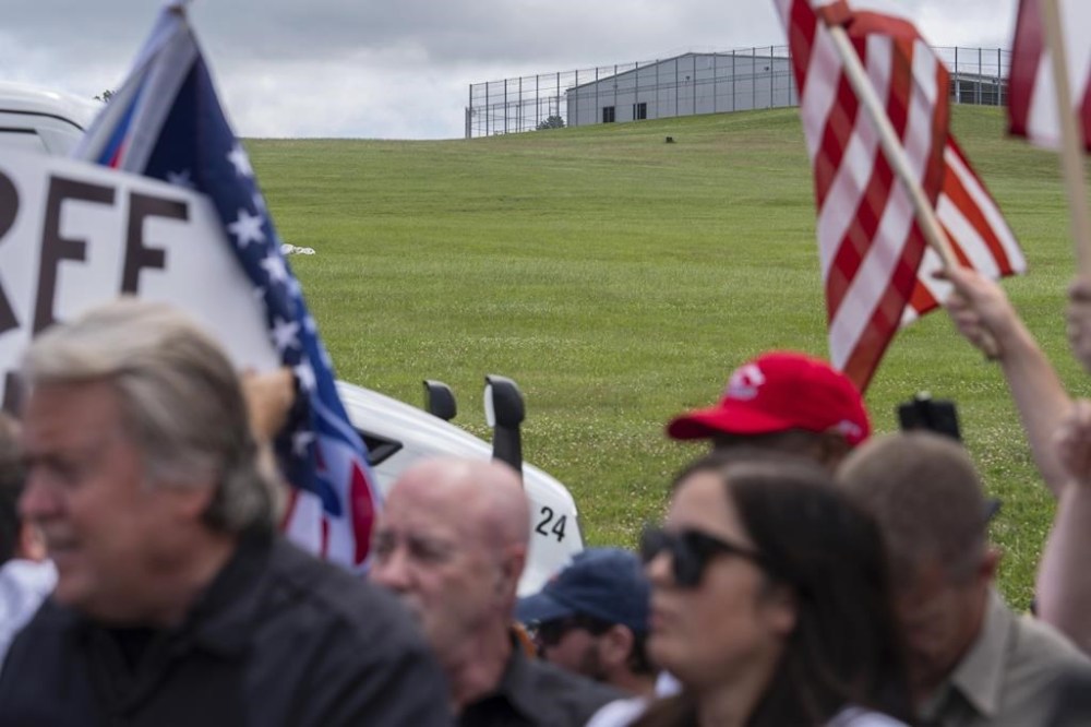 Steve Bannon, left, speaks outside Danbury Federal Correctional Institution, Monday, July 1, 2024, in Danbury, Conn. (AP Photo/Julia Nikhinson)