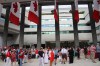 People dressed in red and white ate bacon and pancakes drenched in maple syrup at the Canada Day celebrations at the Embassy of Canada in Washington, D.C., Monday July 1, 2024.THE CANADIAN PRESS/Kelly Geraldine Malone