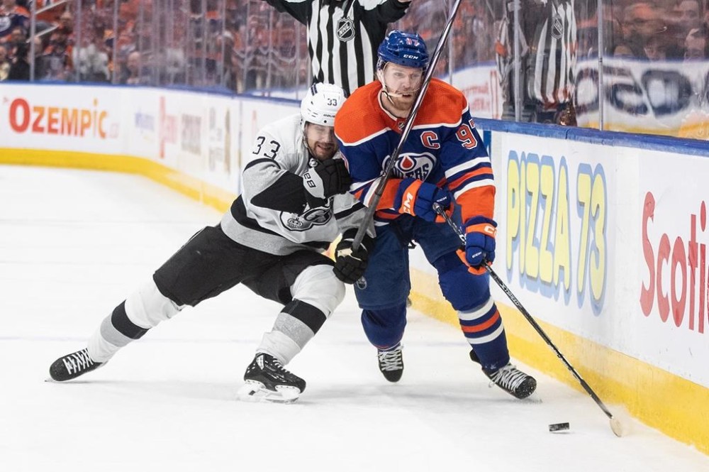 Los Angeles Kings' Viktor Arvidsson (33) and Edmonton Oilers' Connor McDavid (97) battle for the puck during NHL playoff action in Edmonton on Wednesday April 24, 2024.The Oilers have signed forward Arvidsson to a two-year, US$4-million contract and also extended Connor Brown's contract one year. THE CANADIAN PRESS/Jason Franson