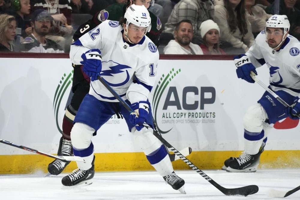 Tampa Bay Lightning forward Alex Barré-Boulet (12) skates with the puck against the Arizona Coyotes during NHL action, Tuesday, Nov. 28, 2023, in Tempe, Ariz. The Montreal Canadiens have signed Barré-Boulet to a one-year, one-way contract.THE CANADIAN PRESS/AP/Ross D. Franklin