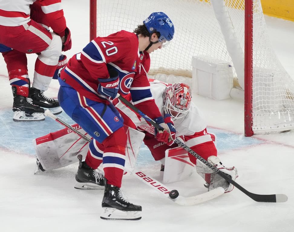Detroit Red Wings goaltender James Reimer (47) makes a save against Montreal Canadiens' Juraj Slafkovsky (20) during second period NHL hockey action against Detroit Red Wings in Montreal on Tuesday, April 16, 2024. Slafkovsky got a Canada Day payday. The Canadiens signed the forward to an eight-year, US$60.8 million contract extension beginning in 2025-26. THE CANADIAN PRESS/Christinne Muschi