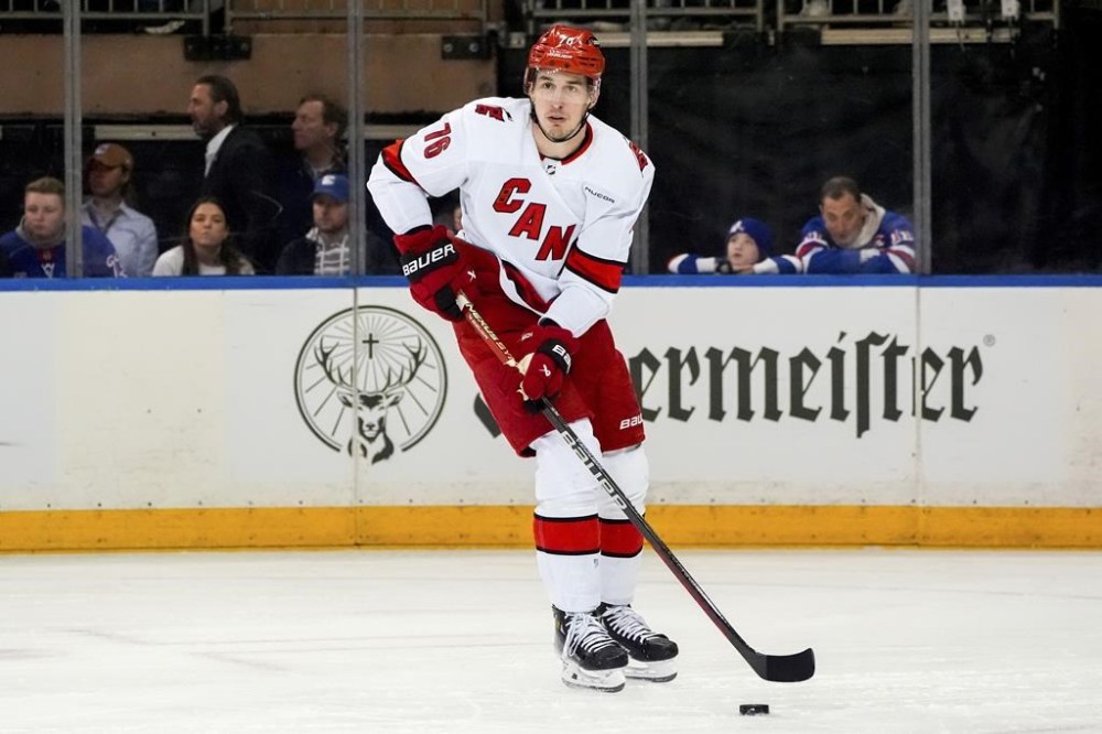 FILE - Carolina Hurricanes defenseman Brady Skjei (76) skates with the puck during Game 1 of an NHL hockey Stanley Cup second-round playoff series against the New York Rangers, Sunday, May 5, 2024, in New York. The Nashville Predators made a big splash in the opening minutes of NHL free agency by signing Steven Stamkos, Jonathan Marchessault and Brady Skjei. (AP Photo/Julia Nikhinson, File)