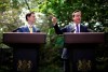 FILE - New British Prime Minister David Cameron, right, and Deputy Prime Minister Nick Clegg hold their first joint press conference in the garden of 10 Downing Street in London, May 12, 2010. When Prime Minister Gordon Brown called the general election for May 2010, Labour, which had been in power for 13 years, its longest stretch in government, did better than expected and denied the Conservative Party, now led by the smooth David Cameron, a majority in the House of Commons. Following days of frenzied negotiations, Cameron was able to seal a deal with the centrist Liberal Democrats, to create the first coalition government since the war. (AP Photo/Christopher Furlong, pool, file)