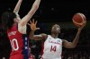Canada's Kayla Alexander, right, shoots as United States' Breanna Stewart defends during their semifinal game at the women's Basketball World Cup in Sydney, Australia, Friday, Sept. 30, 2022. Alexander, Natalie Achonwa and Kia Nurse headline the Canadian women's basketball team headed to the Paris Olympics. THE CANADIAN PRESS/AP/Mark Baker