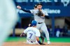 The Toronto Blue Jays have placed infielder Isiah Kiner-Falefa on the 10-day injured list with a left knee sprain. New York Yankees second baseman Jahmai Jones (14) forces out Kiner-Falefa (7) and throws to first base to complete the double play during fourth-inning MLB action in Toronto, Thursday, June 27, 2024. THE CANADIAN PRESS/Frank Gunn