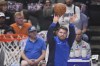 Dallas Mavericks guard Luka Doncic (77) warms up for Game 4 of the NBA basketball finals against the Boston Celtics, Friday, June 14, 2024, in Dallas. (AP Photo/Julio Cortez)