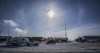 An RCMP helicopter flies over as a truck convoy of anti-COVID-19 vaccine mandate demonstrators block the highway at the busy U.S. border crossing in Coutts, Alta., Wednesday, Feb. 2, 2022. One of two men accused of conspiring to kill Mounties at the 2022 Coutts border blockade told his mother there 
