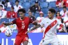 Canada's Tajon Buchanan, 17, and Peru's Paolo Guerrero battle for the ball during a Copa America Group A soccer match in Kansas City, Kan., Tuesday, June 25, 2024. (AP Photo/Reed Hoffmann)