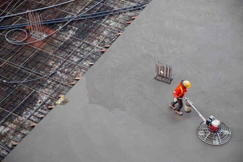 A worker smooths concrete at a housing development in Toronto, Thursday, Jan. 16, 2020. THE CANADIAN PRESS/Cole Burston