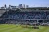 FILE - With the skyline of Kansas City behind them, both teams line up before the start of an NWSL soccer match between the Kansas City Current and the Portland Thorns FC at the new CPKC Stadium, Saturday, March 16, 2024, in Kansas City, Mo. The championship game of the National Women's Soccer League will be played Nov. 23 at CPKC Stadium, the home of the Kansas City Current and one of the first purpose-built stadiums for a professional women's team in the world. The league made the announcement Wednesday, July 3, 2024.(AP Photo/Reed Hoffmann, File)