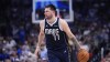 Dallas Mavericks guard Luka Doncic (77) bring the ball up court against the Boston Celtics during the first half in Game 4 of the NBA basketball finals, Friday, June 14, 2024, in Dallas. (AP Photo/Julio Cortez)