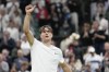 Jack Draper of Britain celebrates after defeating Elias Ymer of Sweden in their first round match at the Wimbledon tennis championships in London, Tuesday, July 2, 2024. (AP Photo/Alberto Pezzali)
