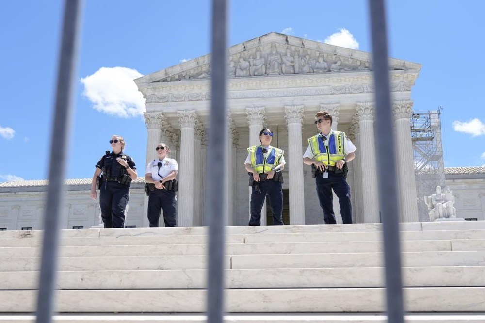 Supreme Court Police officers stand outside the Supreme Court Monday, July 1, 2024, in Washington. (AP Photo/Mariam Zuhaib)