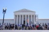 People protest outside the Supreme Court Monday, July 1, 2024, in Washington. (AP Photo/Mariam Zuhaib)