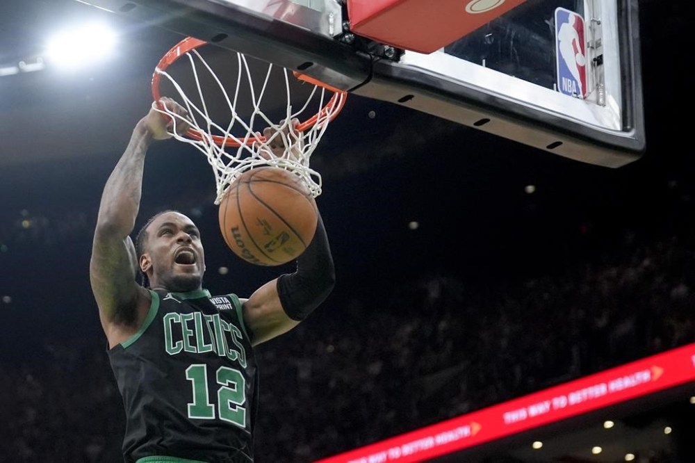 Boston Celtics forward Oshae Brissett dunks against the Indiana Pacers during the second half of Game 2 of the NBA Eastern Conference basketball finals Thursday, May 23, 2024, in Boston. Oshae Brissett and Kyle Alexander have been released from Canada's Olympic men's basketball training camp, Canada Basketball announced Wednesday. THE CANADIAN PRESS/AP, Steven Senne