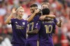 Orlando City SC midfielder Martin Ojeda (second left) embraces forward Ivan Angulo (77) and forward Facundo Torres (10) after scoring the first goal against Toronto FC during the first half of their MLS soccer match in Toronto, Wednesday, July 3, 2024. THE CANADIAN PRESS/Cole Burston