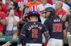 Washington Nationals' Luis García Jr. gets a celebratory hat after his three-run homer as James Wood looks on during the sixth inning of a baseball game against the New York Mets at Nationals Park, Wednesday, July 3, 2024, in Washington. (AP Photo/Alex Brandon)