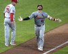 St. Louis Cardinals' Willson Contreras (40) celebrates as he rounds third after hitting a two-run home run off Pittsburgh Pirates relief pitcher Colin Holderman during the eighth inning of a baseball game in Pittsburgh, Wednesday, July 3, 2024. The Pirates won in ten innings, 5-4. (AP Photo/Gene J. Puskar)