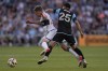 Vancouver Whitecaps midfielder Ryan Gauld, left, and Minnesota United midfielder Alejandro Bran (25) battle for possession during the first half of an MLS soccer match in St. Paul, Minn., Wednesday, July 3, 2024. (AP Photo/Abbie Parr)