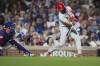 Philadelphia Phillies' Whit Merrifield hits a single during the eighth inning of a baseball game against the Chicago Cubs, Wednesday, July 3, 2024, in Chicago. (AP Photo/Erin Hooley)