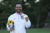 FILE - Xander Schauffele, of the United States, holds his gold medal in the men's golf at the 2020 Summer Olympics on Sunday, Aug. 1, 2021, in Kawagoe, Japan. Qualifying for the Paris Games was the hardest part for Schauffele and the Americans. ((AP Photo/Andy Wong, File)